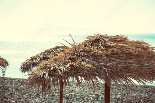 Close up of beach umbrella in a Santorini beach