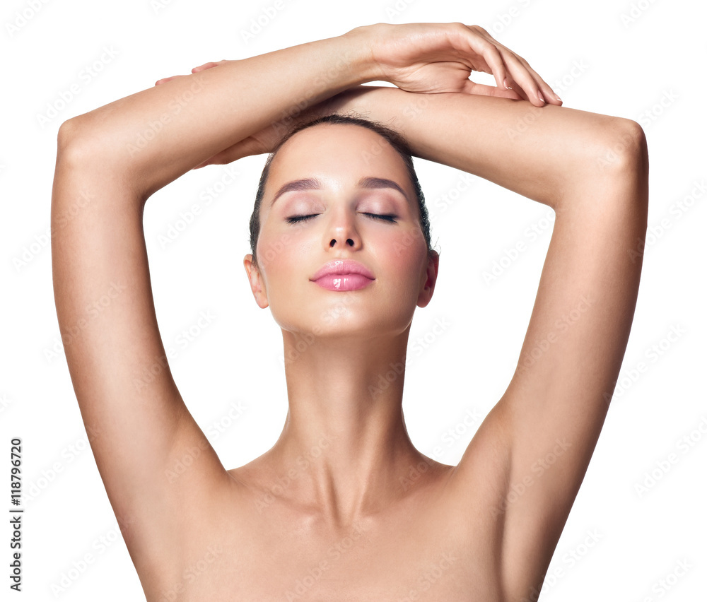 Beautiful young woman holding her arms up and showing clean unde Beautiful young woman holding her arms up and showing clean unde