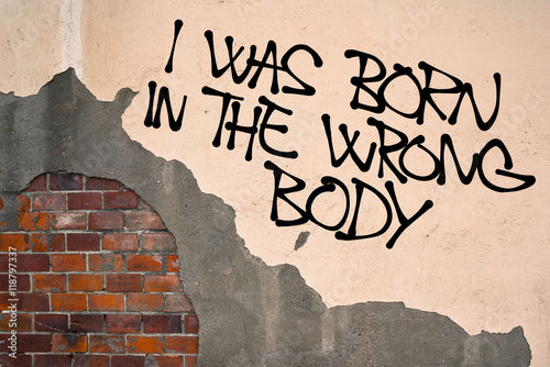 I Was Born In Wrong Body - handwritten graffiti sprayed on the wall, anarchist aesthetics - inconsistency of biological and physical sex and gender, sex change (sex reassignment therapy and surgery )