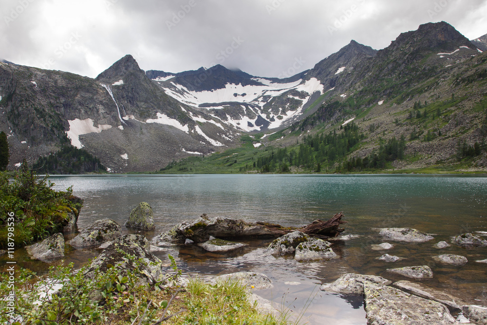 Clear mountain lake on a cloudy day, Altai.