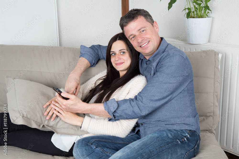 Romantic and lovely couple relaxing in couch Romantic and lovely couple relaxing in couch