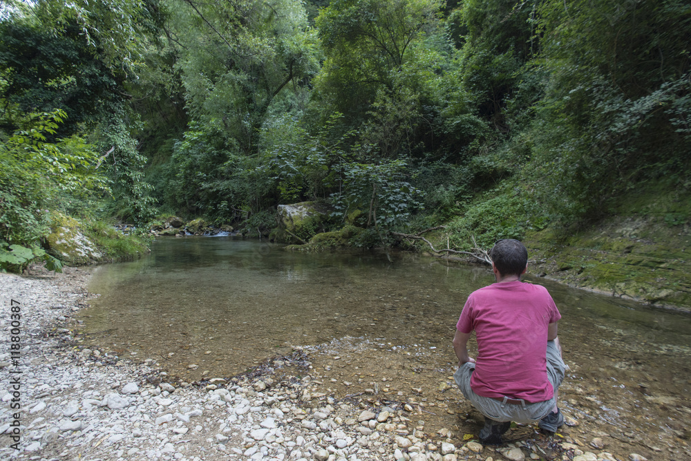 Man on the river, trekking, mountain Man on the river, trekking, mountain