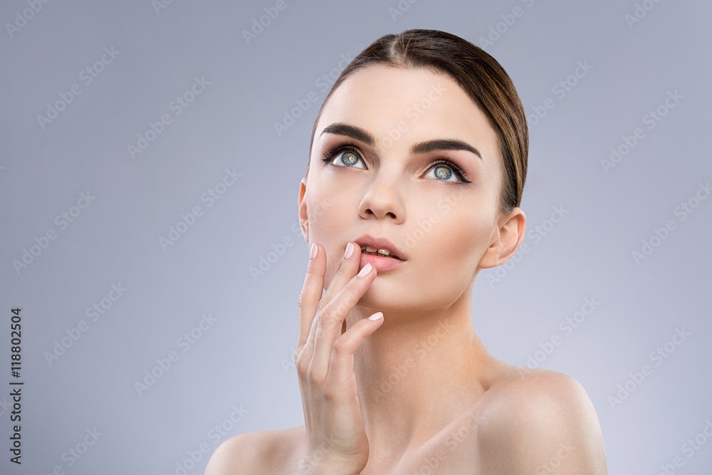 Gorgeous make up model at gray background Gorgeous make up model at gray background