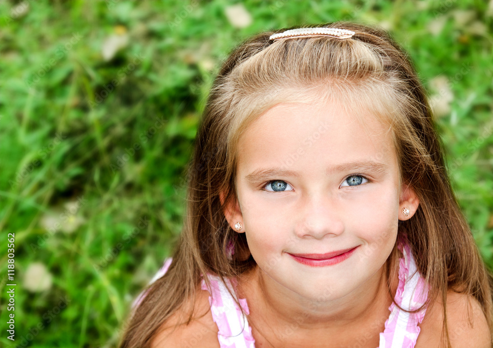 Portrait of adorable smiling little girl in summer day Portrait of adorable smiling little girl in summer day
