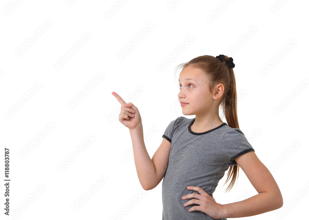 preteen girl pointing at copy space