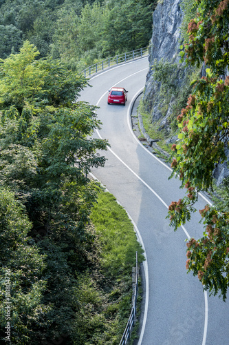 Red car on mountain road