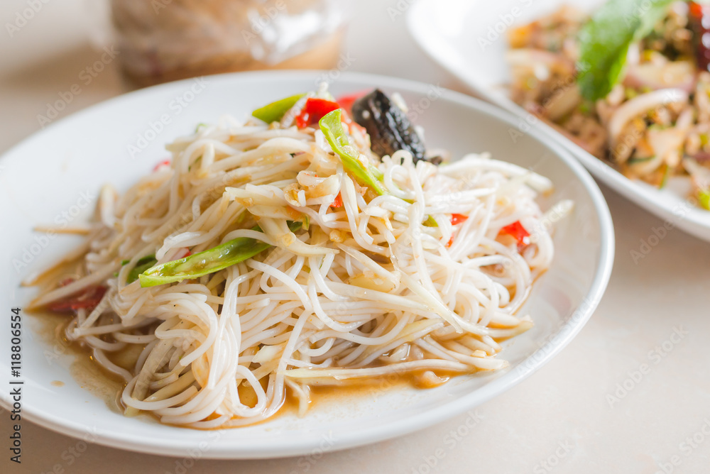 Close up Papaya Salad with Vermicelli, Salted Crab and Fermented