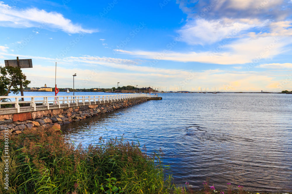 Sea pier landscape, old wooden pier and blue sky Sea pier landscape, old wooden pier and blue sky