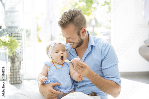 Father feeding baby