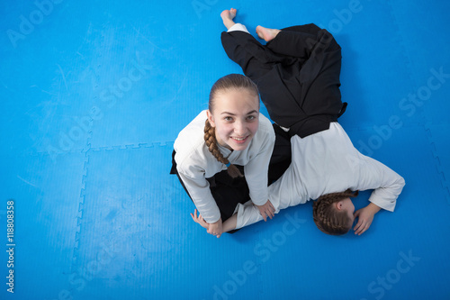 Quadro su tela Two girls in black hakama training on Aikido training