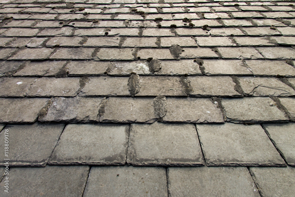 close-up of aged slate roof tiles 