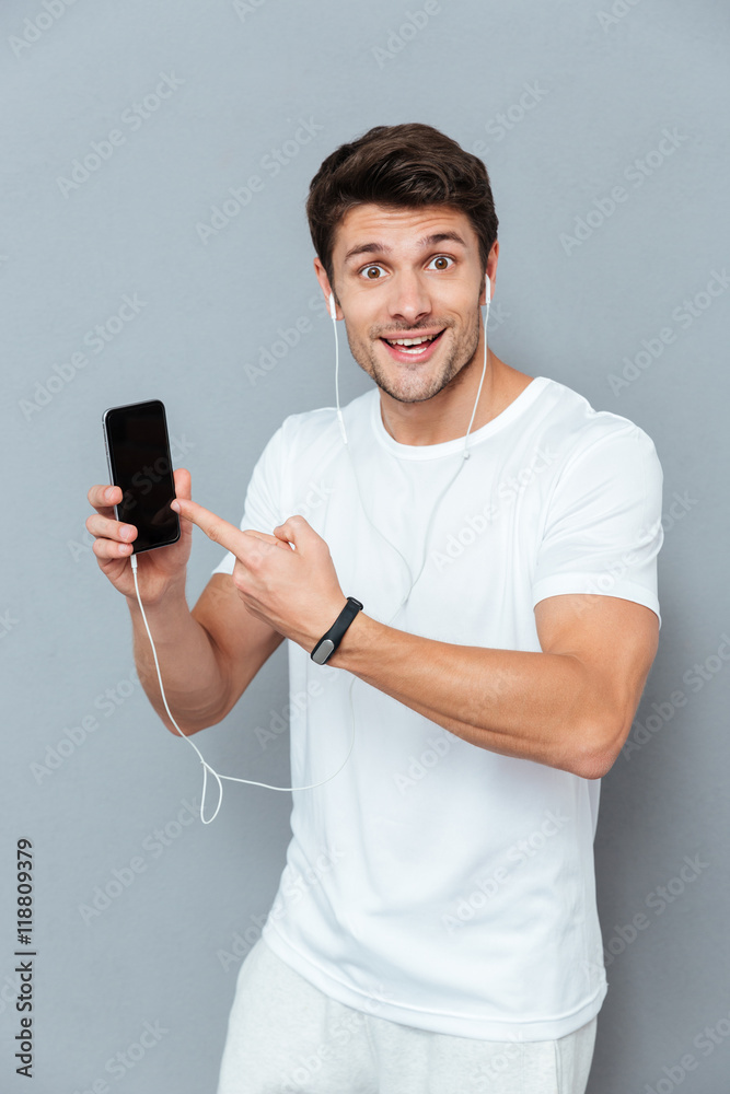 Man pointing finger at smart phone Man pointing finger at smart phone