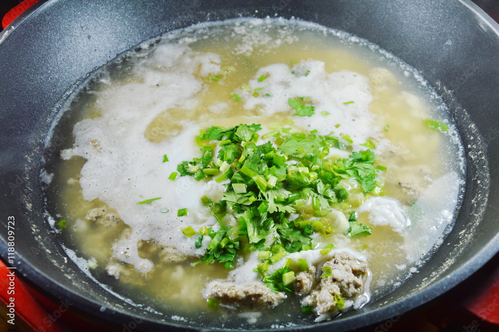 hot boiled rice with minced pork dressing parsley on steamed pot hot boiled rice with minced pork dressing parsley on steamed pot