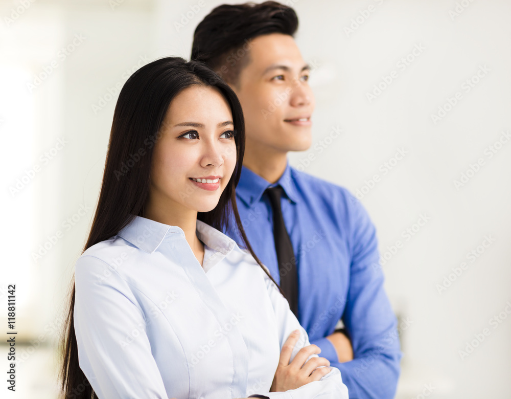 young business man and woman standing in office young business man and woman standing in office