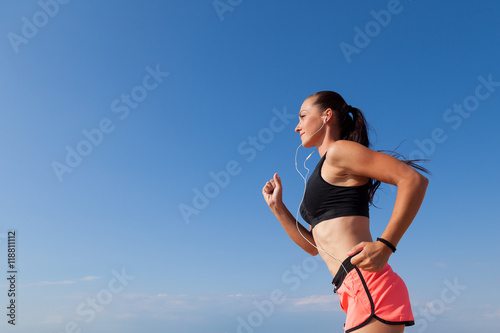 girl goes in for sports runs and listens to music