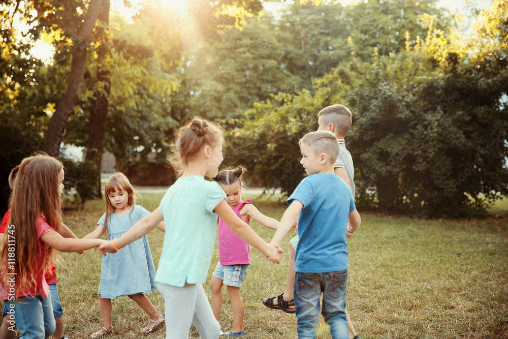 Fototapeta premium Group of playful kids in park