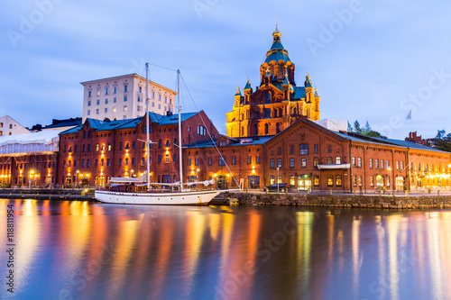 The Night view of the Orthodox Uspenski cathedral and lighted boat in the Harbour. photo