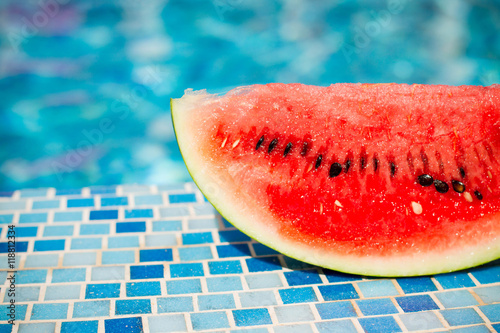 slices of fresh juicy organic watermelon on a pool