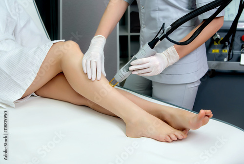 Hair removal cosmetology procedure from a therapist at cosmetic