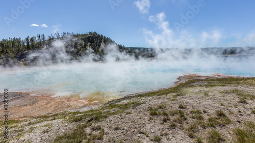 Amazing blue lake. Steam rises high above the lake. Colorful landscapes of geothermal activity Midway Geyser Basin, Yellowstone National Park, Wyoming