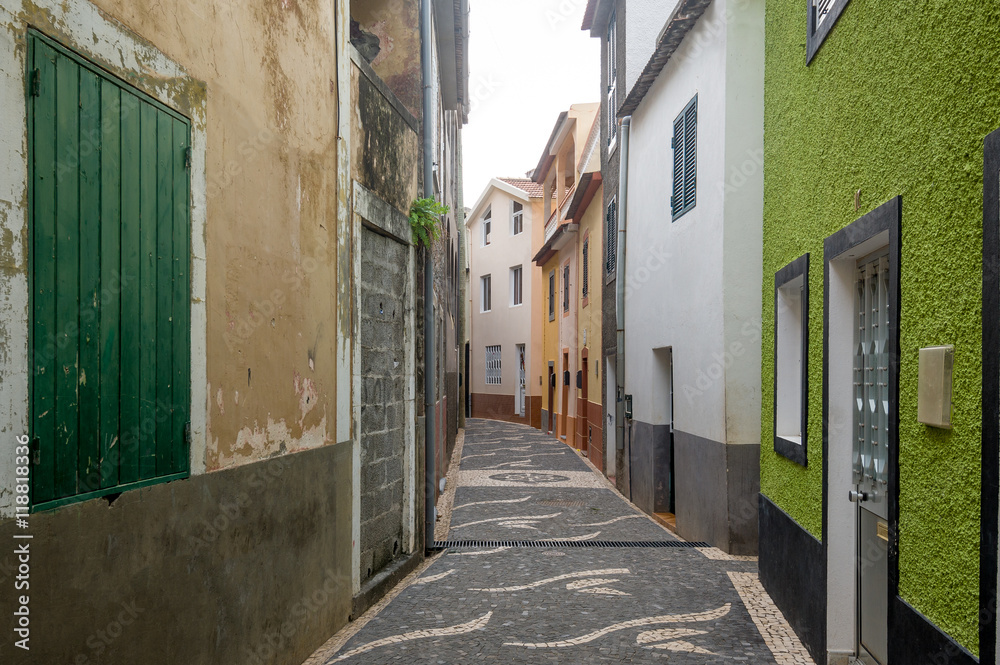 Narrow street with old houses at Paul do Mar, Madeira.