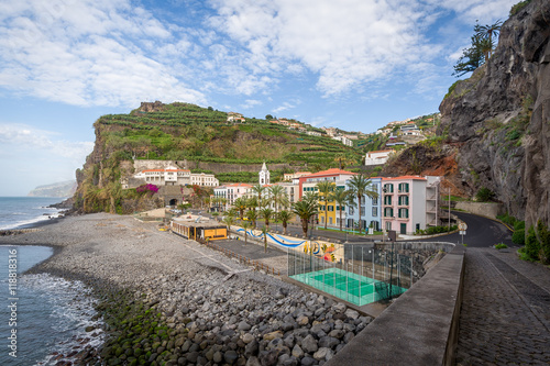 Ponta do Sol town with colorful houses surrounded by rucky mountains, Madeira.