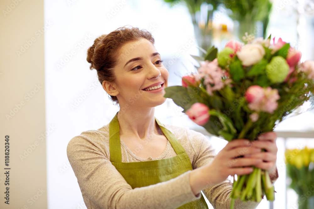 smiling florist woman making bunch at flower shop smiling florist woman making bunch at flower shop