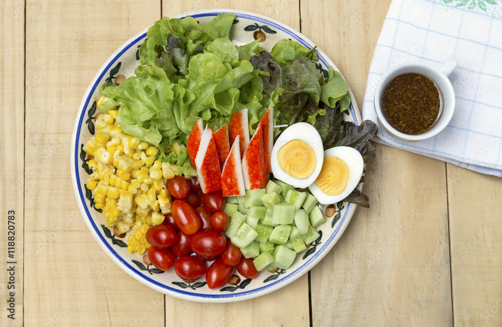 Fresh mixed vegetable salad with boil egg and crab stick and Japanese salad dressing, healthy lifestyle Fresh mixed vegetable salad with boil egg and crab stick and Japanese salad dressing, healthy lifestyle