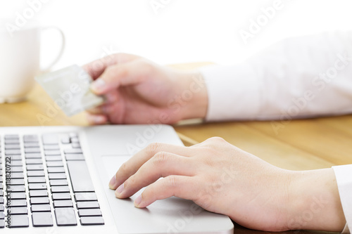 Man using his digital tablet and holding credit card intent to online shopping, concept, digital business or e-commerce, close up.