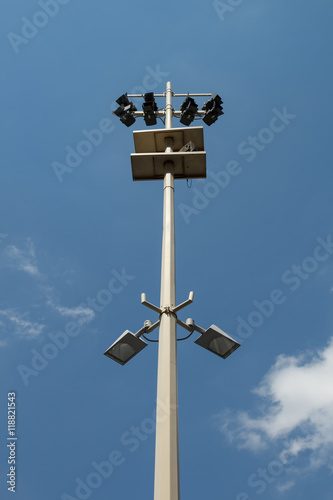A lamp post with multiple different light sources