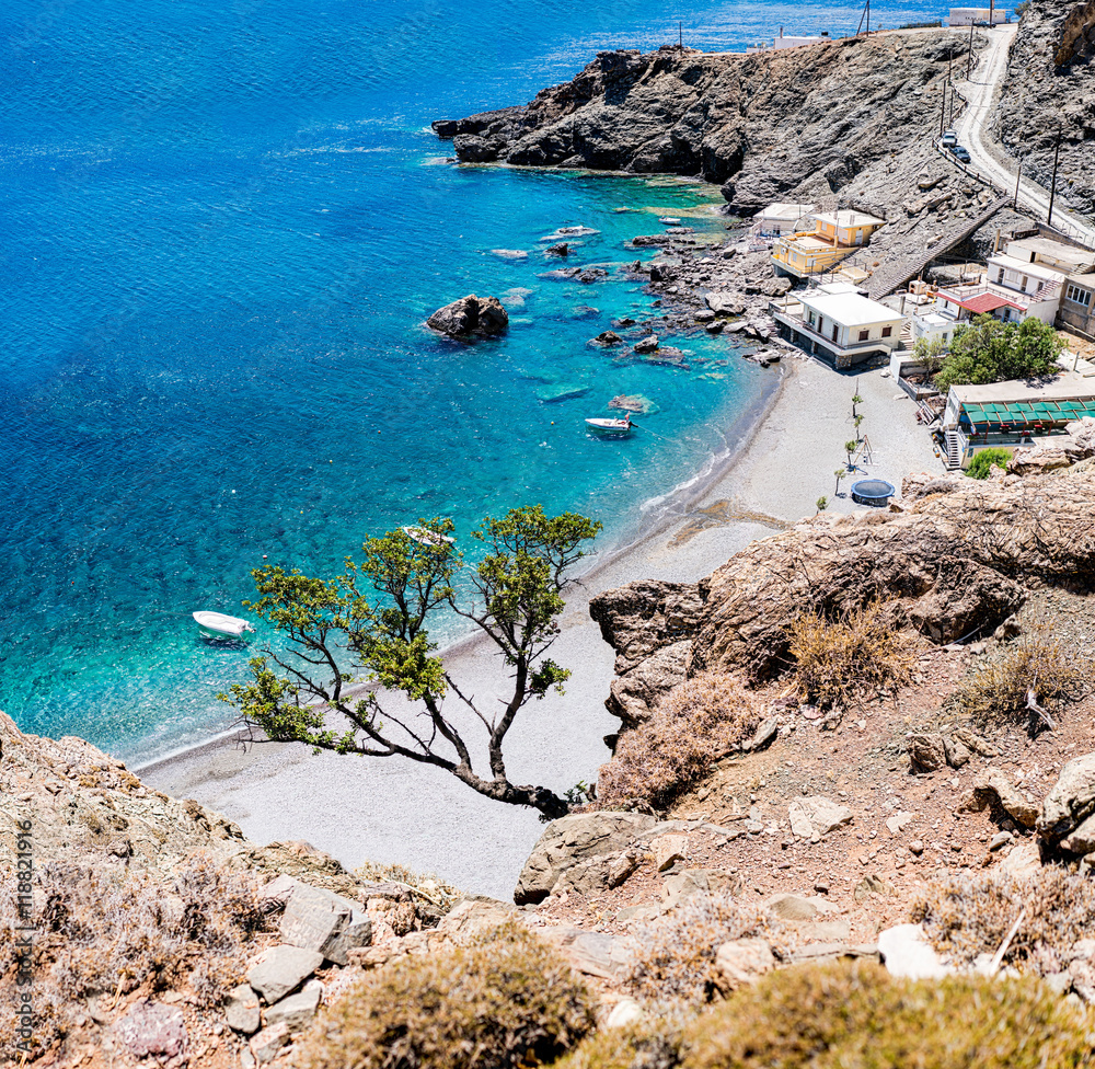 Obraz premium Maridaki beach. A beautiful remote beach in south Crete, Greece. Accessible by car by a long dirt road or by a 45-minutes trekking path from the nearest beach of Tsoutsouros.