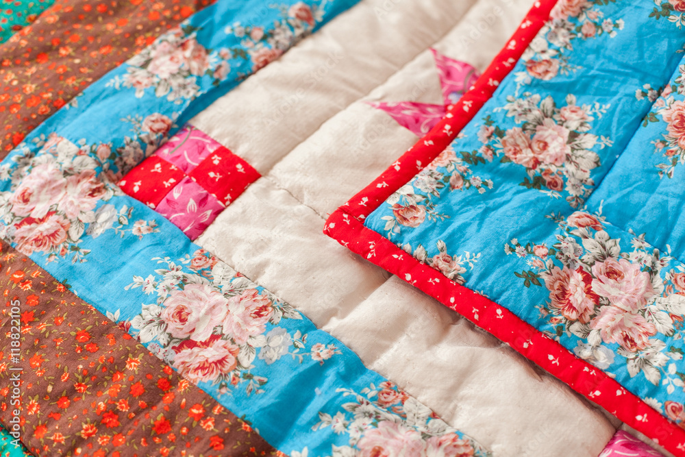 Patchwork quilt. Part of patchwork quilt as background. Flower print.