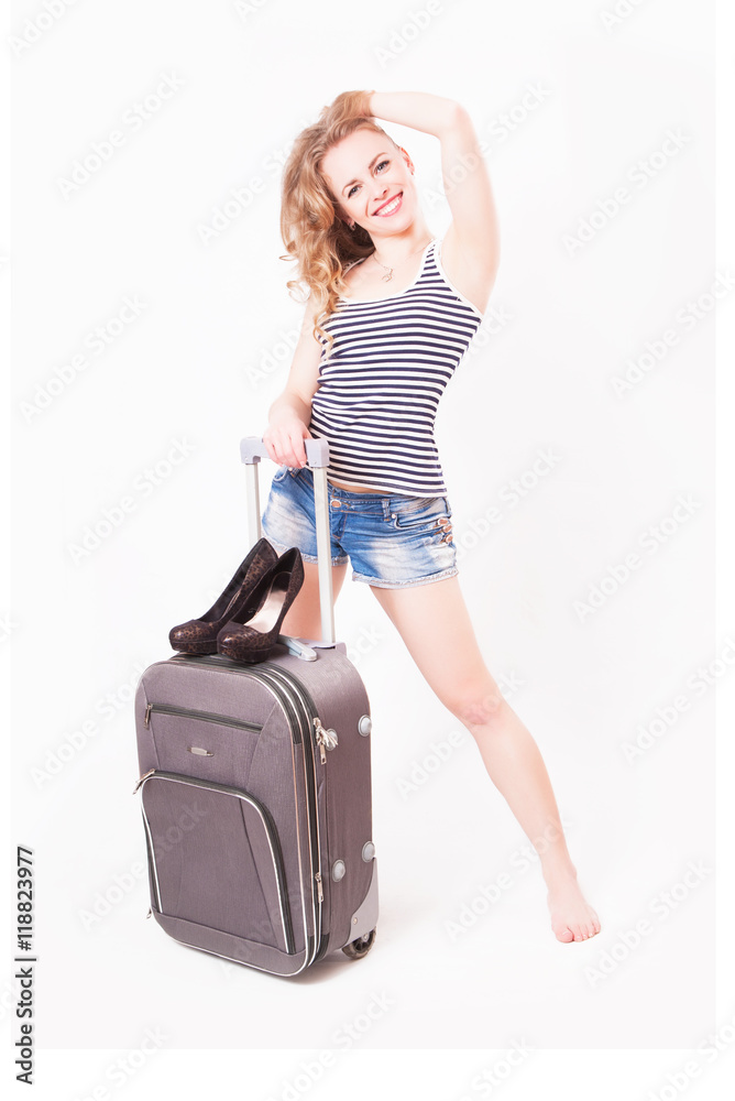 Cute beautiful young woman with a suitcase Cute beautiful young woman with a suitcase