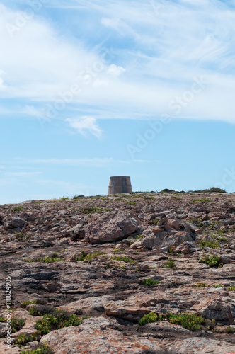 Formentera, Isole Baleari: vista della scogliera e delle rocce di Punta Prima con la Torre de sa Punta Prima l'11 settembre 2010