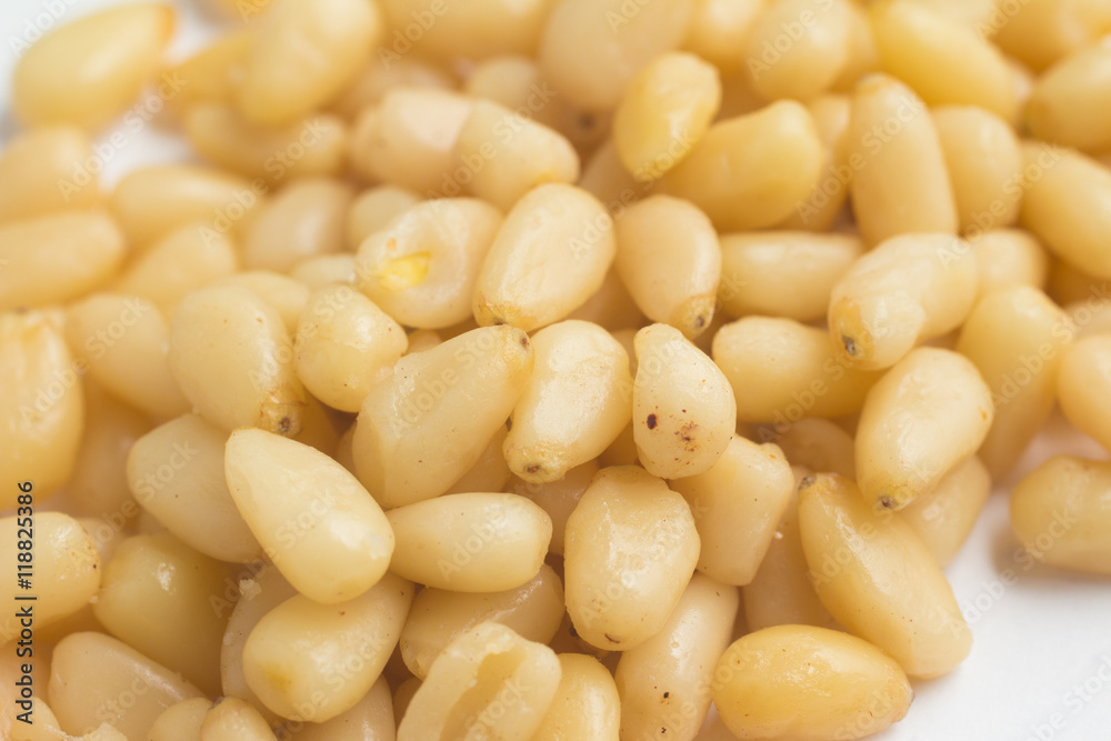 Close-up on Pine Nuts in white background Close-up on Pine Nuts in white background