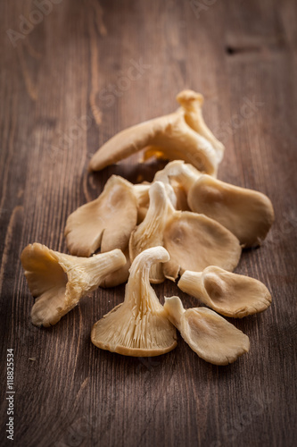 Fresh organic oyster mushrooms on a wooden table