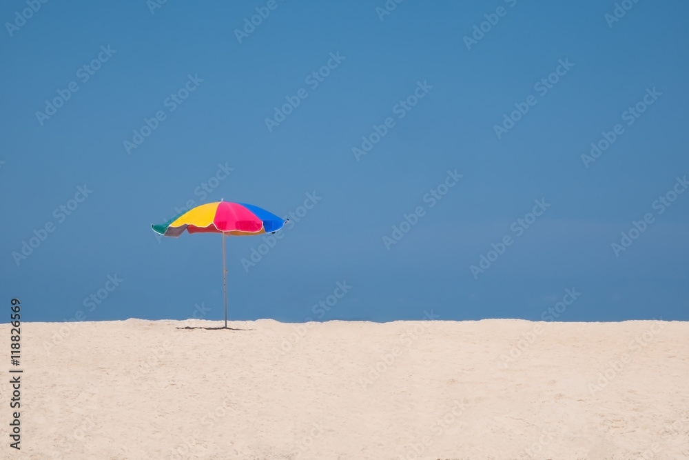 beach umbrella on blue sky