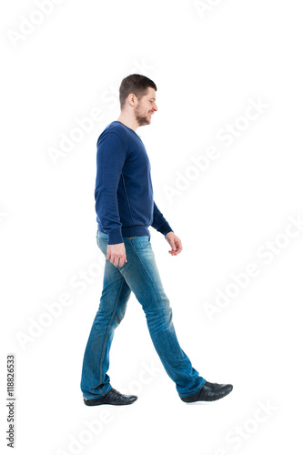 Back view of going handsome man. walking young guy . Rear view people collection. backside view of person. Isolated over white background. bearded man in blue pullover thoughtfully misses.