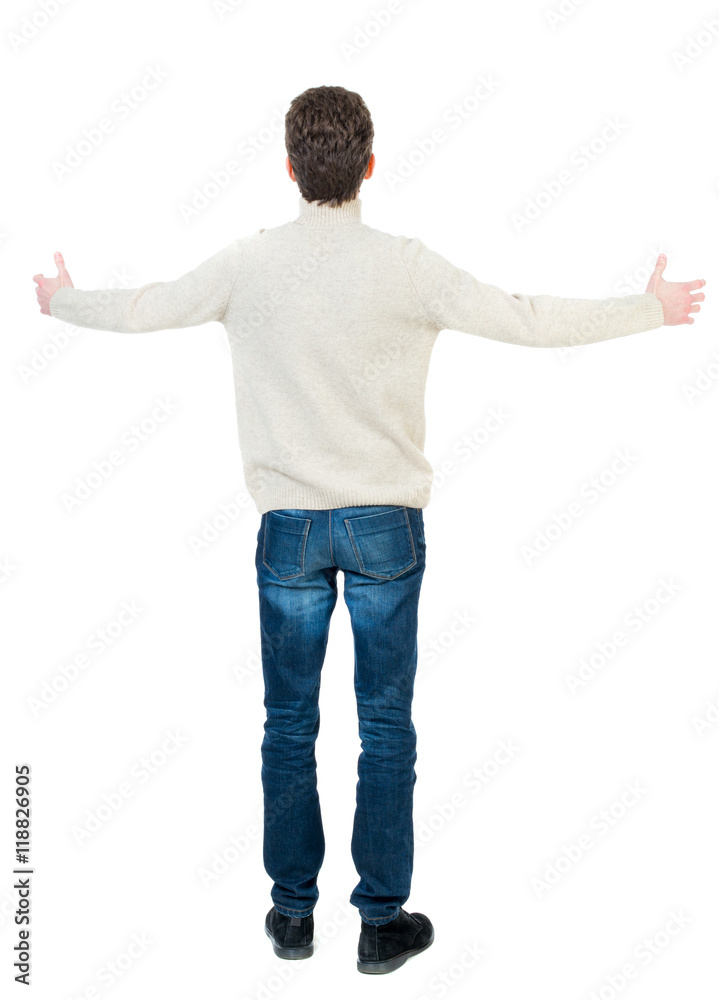 A man in a jacket raised his hands in prayer. Standing young man. Rear view people collection. backside view of person. Isolated over white background. Curly short-haired man in a woolen white A man in a jacket raised his hands in prayer. Standing young man. Rear view people collection. backside view of person. Isolated over white background. Curly short-haired man in a woolen white