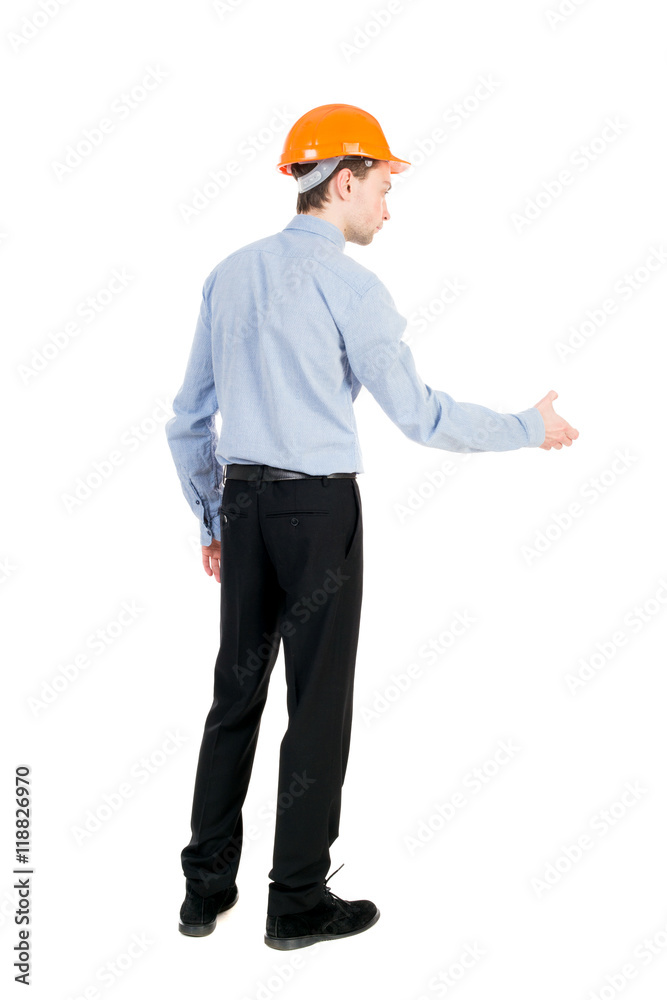 Backview of an engineer in construction helmet stands. Standing young guy. Rear view people collection. backside view of person. Isolated over white background. Curly businessman in a light jacket Backview of an engineer in construction helmet stands. Standing young guy. Rear view people collection. backside view of person. Isolated over white background. Curly businessman in a light jacket