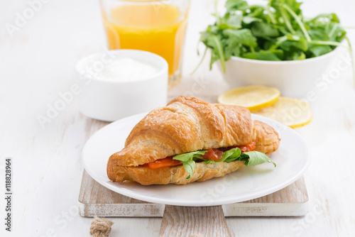 croissant with salted salmon and fresh arugula
