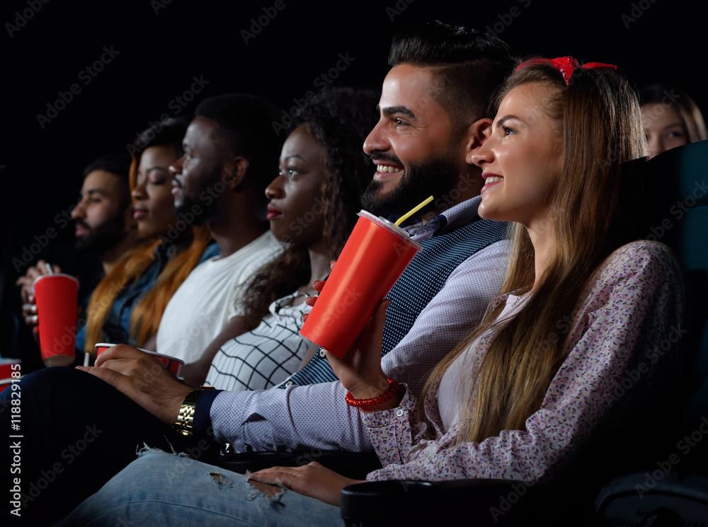Group of friends watching movies at the local cinema