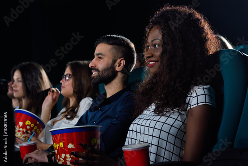 Group of friends watching movies at the local cinema