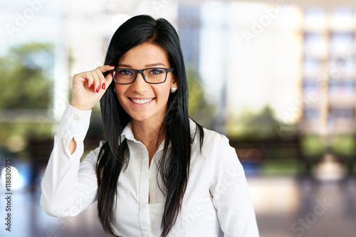 Happy business woman with sunglasses