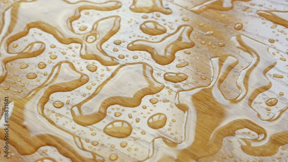 Parquet. Drops of water on wooden surface.
Parquet. Drops of water on wooden surface.