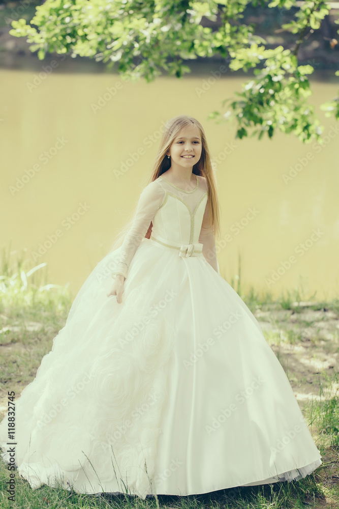 small girl in white dress outdoor