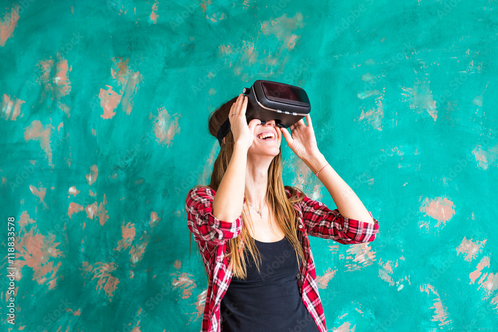 technology, entertainment and people concept - happy young woman with virtual reality headset or 3d glasses technology, entertainment and people concept - happy young woman with virtual reality headset or 3d glasses