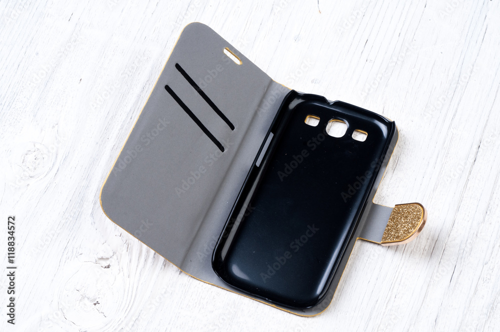 Cover for smart phone on rustik wooden background Cover for smart phone on rustik wooden background