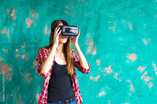 technology, entertainment and people concept - happy young woman with virtual reality headset or 3d glasses © satura_