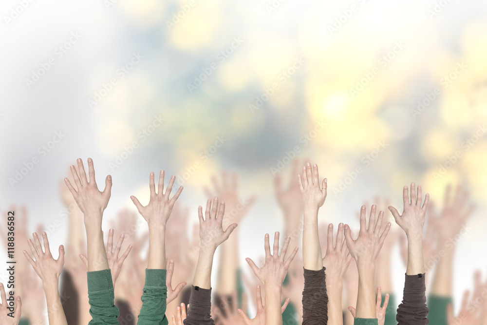 Crowd of people and hands up with a blurred background